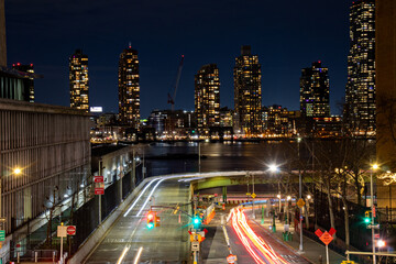 Fototapeta na wymiar long exposure traffic in front of a city skyline