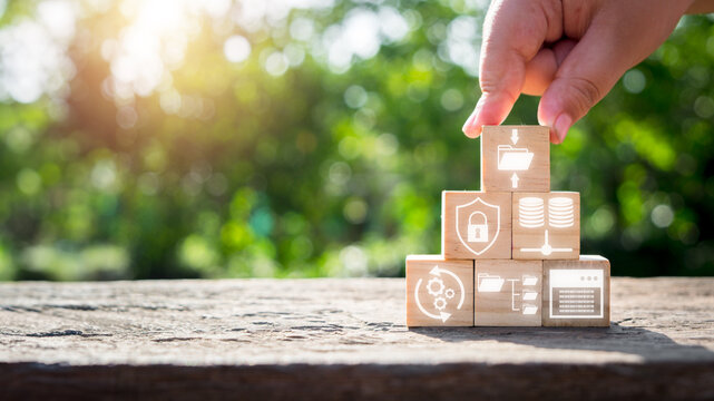 Data compression concept, Man hand holding wooden block with data compression icon on virtual screen. Archive, Data Storage, Security, Algorithm, Binary Code, Technology, Redundancy, Encoding.
