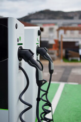 Electric car charging station on a sunny day. Selective focus.