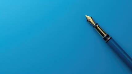 Fototapeta premium Elegant fountain pen on vivid blue, symbolizing creativity and communication