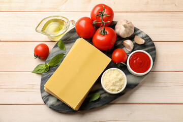 Ingredients for lasagna on white wooden table, flat lay