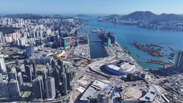 Seaside Commercial residential construction site in Kai Tak Cruise Terminal Hong Kong city, Kwun Tong, and Kowloon Bay near Victoria harbor, Aerial drone Skyview