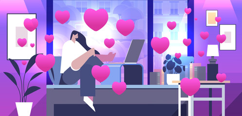 girl in love using laptop social media communication happy valentines day celebration concept living room interior with pink hearts