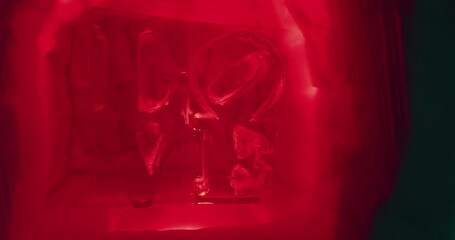 Word love made of a block of ice - Powered by Adobe