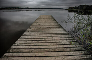 near the lake, lake, wooden pier, autumn time,
 - Powered by Adobe