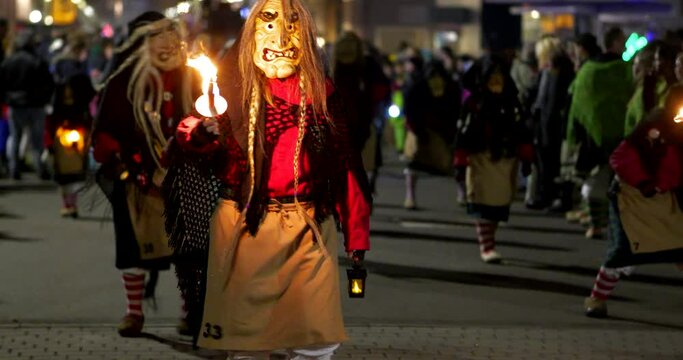 costume parade with scary masks of evil spirits
