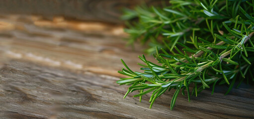 fresh rosemary laying on a wooden table