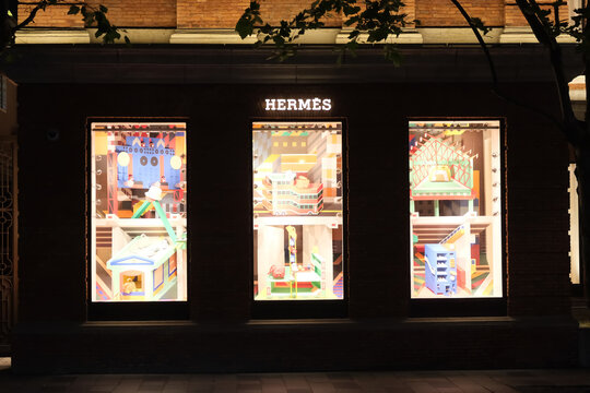 Shanghai,China-May 27th 2023: Herm&egrave;s store sign and store window at night