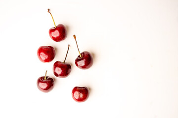 top view of cherries. Sweet cherries. Fresh cherries. Ripe cherries on white background