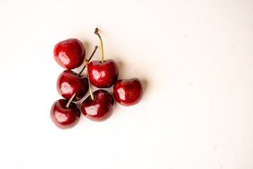 top view of cherries. Sweet cherries. Fresh cherries. Ripe cherries on white background