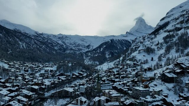Slow drone aerial of the matterhorn over the ski town and resort of Zermatt, Switzerland in the Swiss Alps mountains