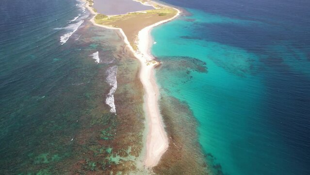 The clear turquoise waters and sandy beach of los roques archipelago in venezuela, aerial view
