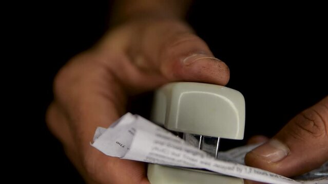 person using stepler