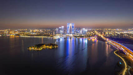 Fototapeta na wymiar Aerial photography of the night view of the city by Jinji Lake in Suzhou.. .笔记.