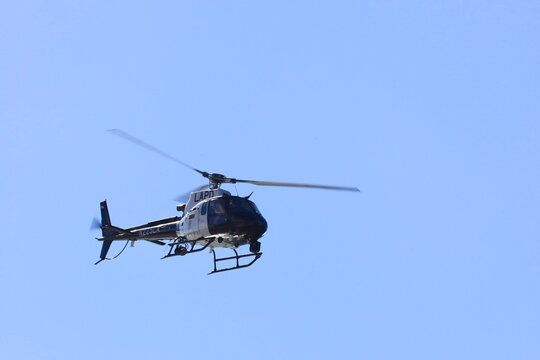 Air Support Division's LAPD helicopter is seen in the Los Angeles city sky. LOS ANGELES, CALIFORNIA, USA - Jan 29	
