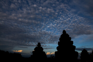 Panoramic cloudscape with the sun rays radiating from behind the cloud.Phnom Bakheng sunset view...