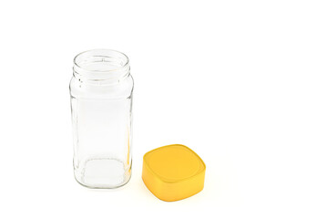 empty glass jar with yellow plastic screw cap