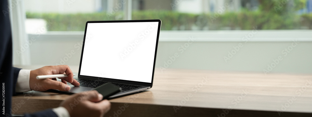 Wall mural young man working businessman using a desktop computer of the blank screen