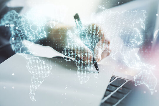 Multi exposure of abstract graphic world map and hand writing in diary on background with laptop, big data and networking concept
