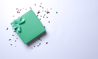 Green gift box wrapped and ribbon on white background. - 728207155