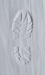 Footprint of shoe in the white sand - 728207185