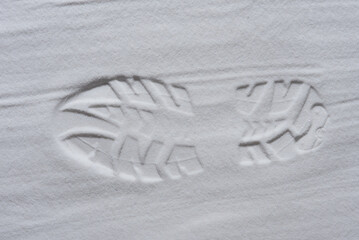 Footprint of shoe in the white sand
