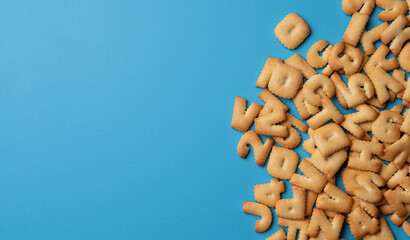 Alphabet biscuit bread isolated on blue background - 728207315