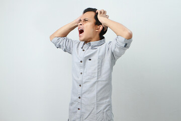 Fototapeta premium Angry mad asian indonesian man expression on isolated bakcground