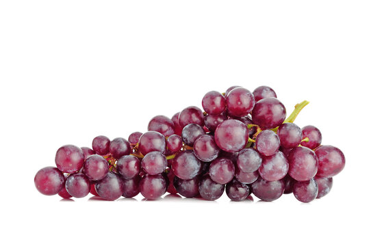 Bunch of fresh ripe red grapes isolated on white background