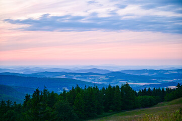 Wasserkuppe Rhön - panoramic view from the Radom observatory on the Wasserkuppe in the Hessian Rhön in summer towards Fulda in the sunset, Hessen, Germany - obrazy, fototapety, plakaty