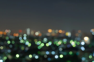 Bokeh abstract background of skyscraper buildings in Bangkok city, Thailand with lights, Blurry...