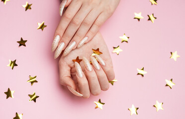 Hands with pearl manicure