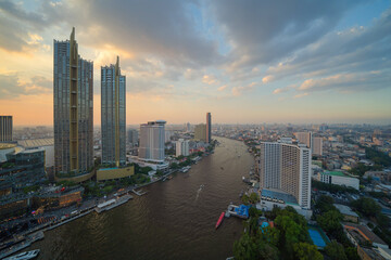 Fototapeta na wymiar Aerial view of Bangkok Downtown Skyline with Chao Phraya River, Thailand. Financial district and business centers in smart urban city in Asia. Skyscraper and high-rise buildings.