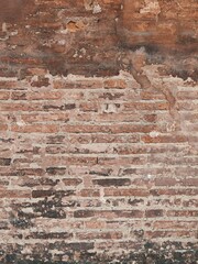 Grunge Red Stonewall Background. Shabby Building Facade With Damaged Plaster.