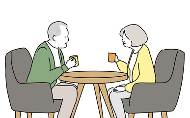 カフェで談笑するシニア世代の男女