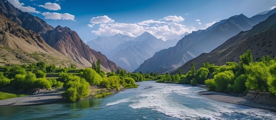 Captivatingly Beautiful River Reveals Flaws Amidst Majestic Fann Mountains - obrazy, fototapety, plakaty