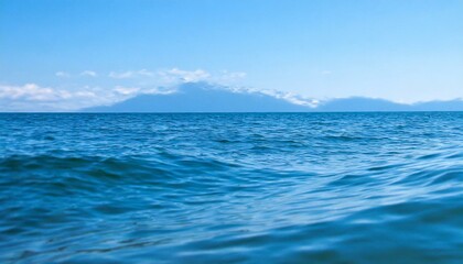 Naklejka na ściany i meble Waves of the open sea under the blue sky. horizon