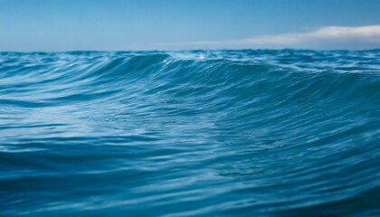 Fototapeta premium Waves of the open sea under the blue sky. horizon