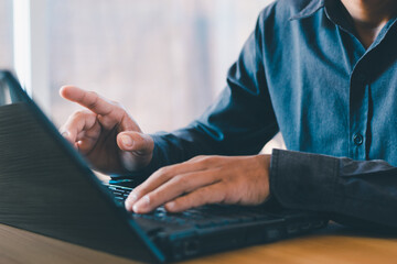 Business people work on laptops in desks or offices, and there is enough space to put text