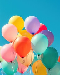 Vividly colored balloons soaring high in the clear blue sky evoking joy and celebration