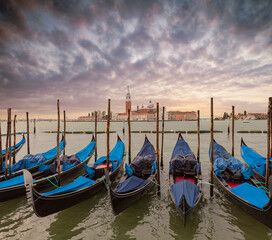 Gondolas moored in St. Mark's Square with the Church of San Giorgio di Maggiore in the background - Venice, Venice, Italy,
