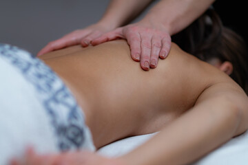 Lomi Lomi Hawaiian back massage at a wellness center, embracing the rhythmic flow for ultimate...