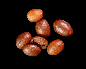Coffee beans isolated on black background. Close-up