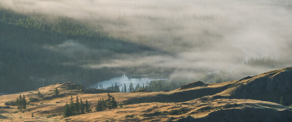 Fog in a mountain valley, panoramic view
