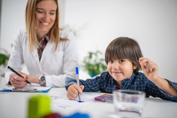 Toddler in a psychology test through coloring shapes, fostering early cognitive development with vibrant educational activities