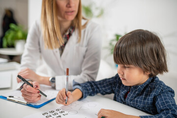 Young mind at work as a toddler engages in a captivating psychology test, showcasing their logical abilities with numbers and fostering early cognitive development