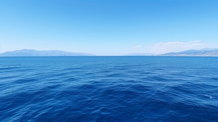 Obraz premium Seascape with blue sea and mountains in the background,