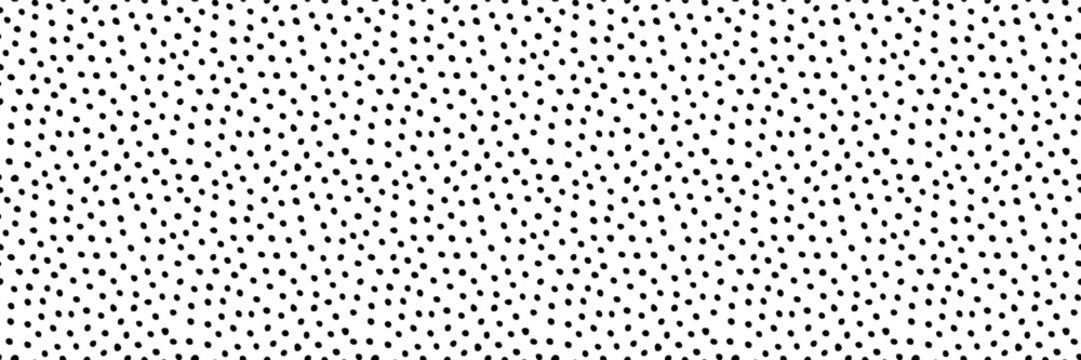 Seamless vector hand drawn irregular tiny polka dot pattern. Small size randomly scattered dots texture. Dotted cute pattern. Black on white artistic doodle sketch tiny dots seamless surface design
