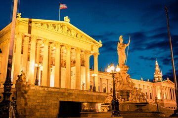 Night summer view of Pallas-Athene-Brunnen, Austrian Parliament Building and NEOS Wien Rathausklub...
