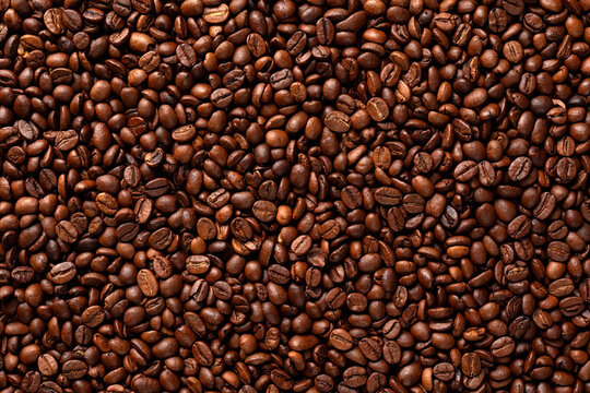 Close-up of many roasted Arabica coffee beans.